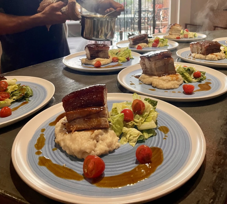 Chef plating a private dinner for guests in Cabo
