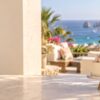 Gift basket delivery in Cabo: flowers, celebration cake, balloons and wrapped gifts at a coastal villa